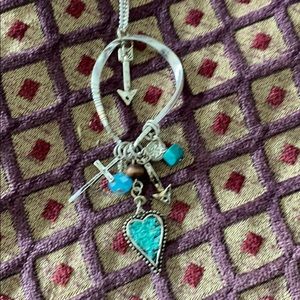 Silver necklace with assorted charms